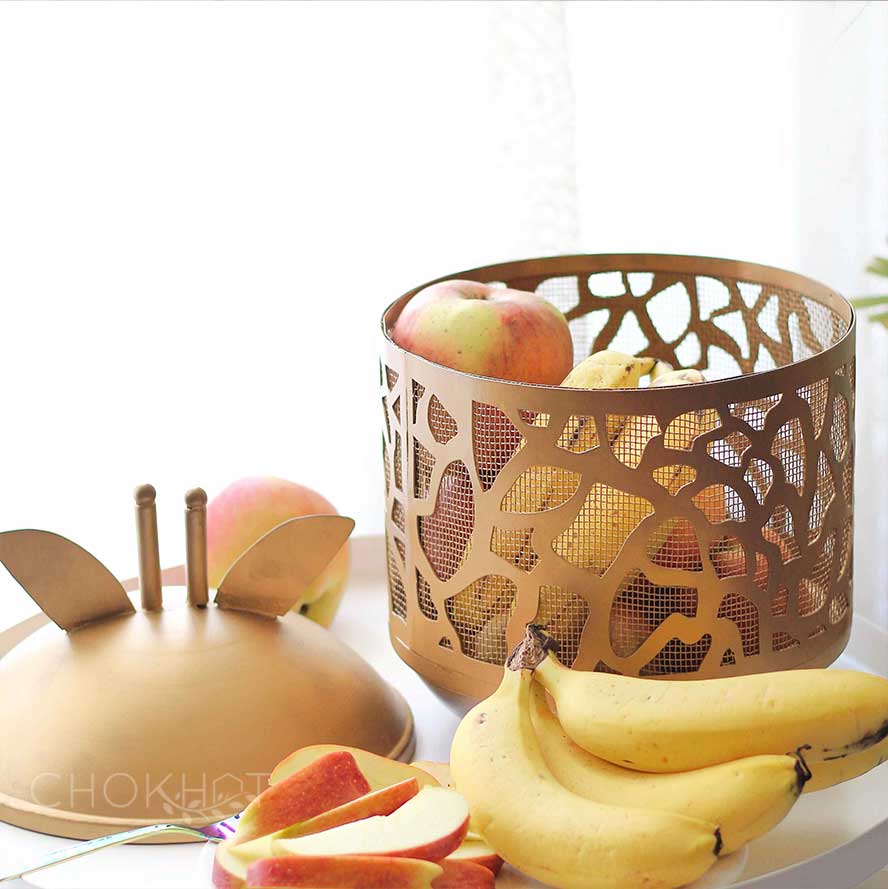 Golden metal giraffe shaped fruit basket