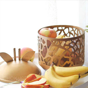 Golden metal giraffe shaped fruit basket