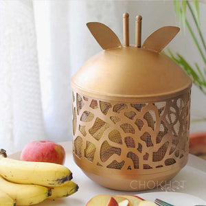 Golden metal giraffe shaped fruit basket