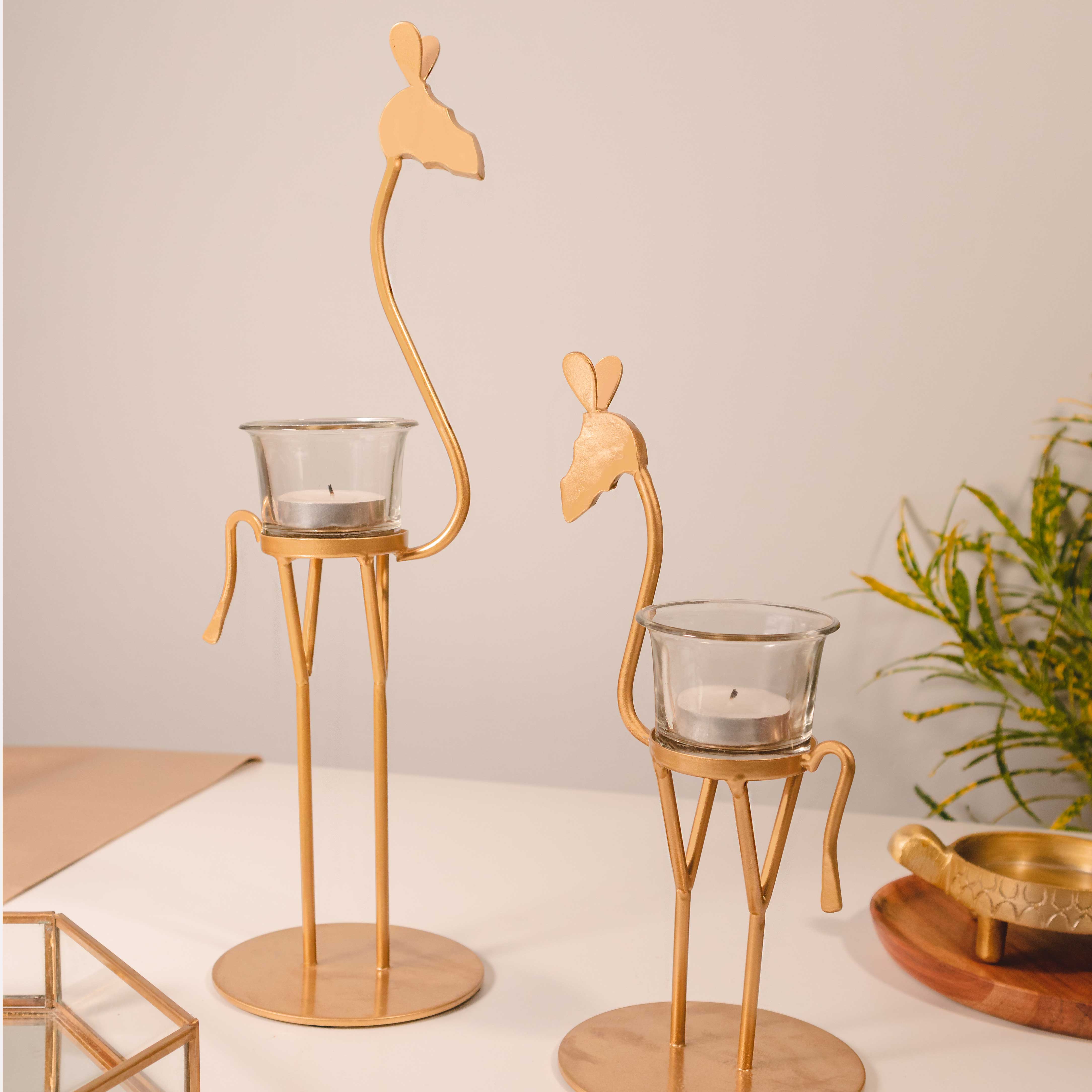 Golden metal giraffe candle holder set